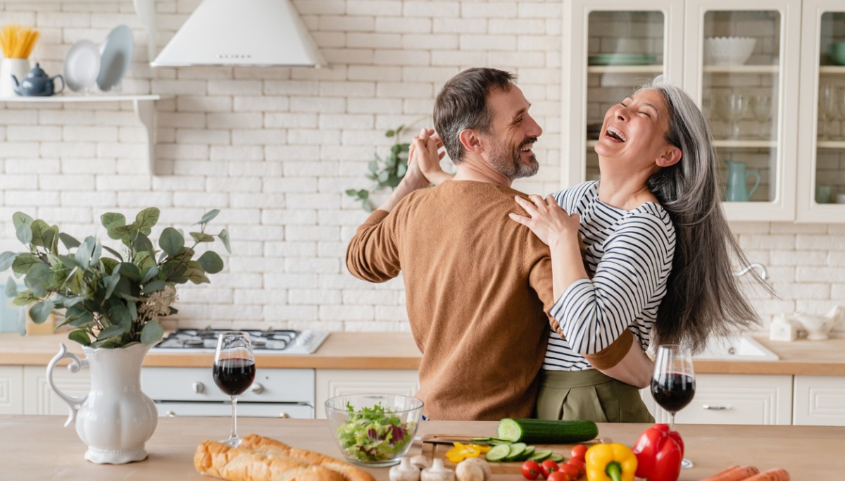 A couple dancing in their kitchen