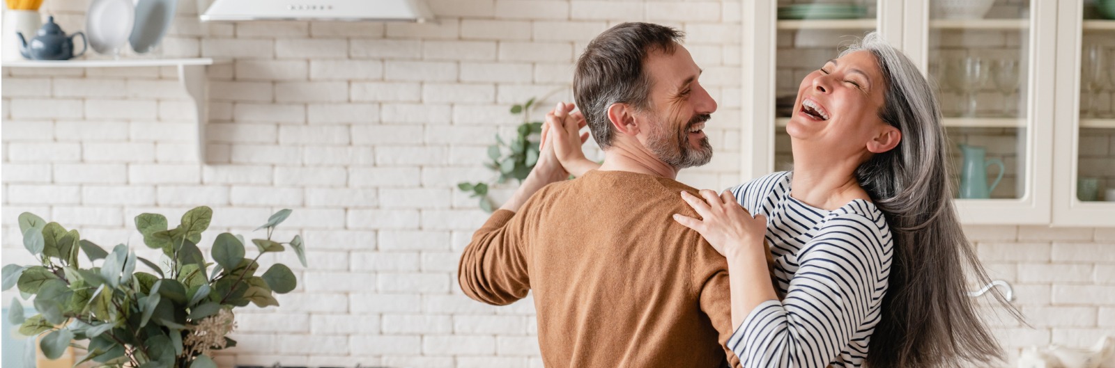 happy-cheerful-middleaged-mature-couple-family-parents-dancing-in-picture-id1328351784.jpg