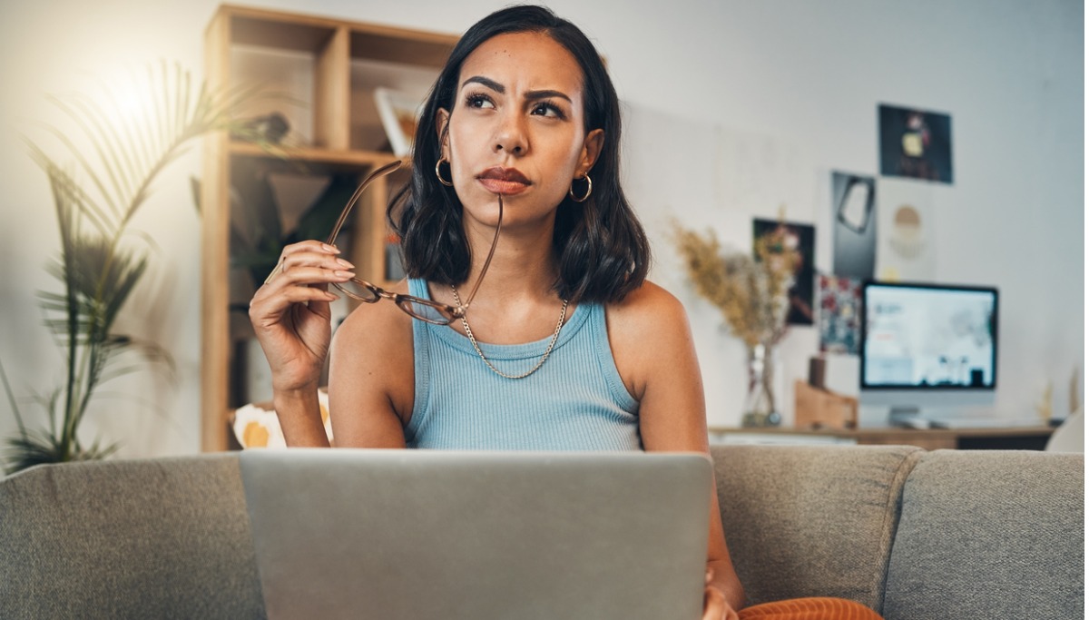A woman thinking about the cost of a wisdom tooth removal