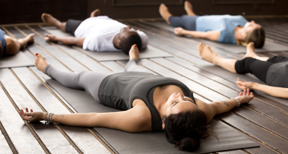 11476-6 Yoga-WomanFloor-560x300.jpg