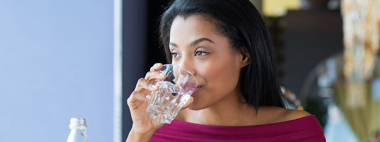 woman-drinking-water_1327x497.jpg