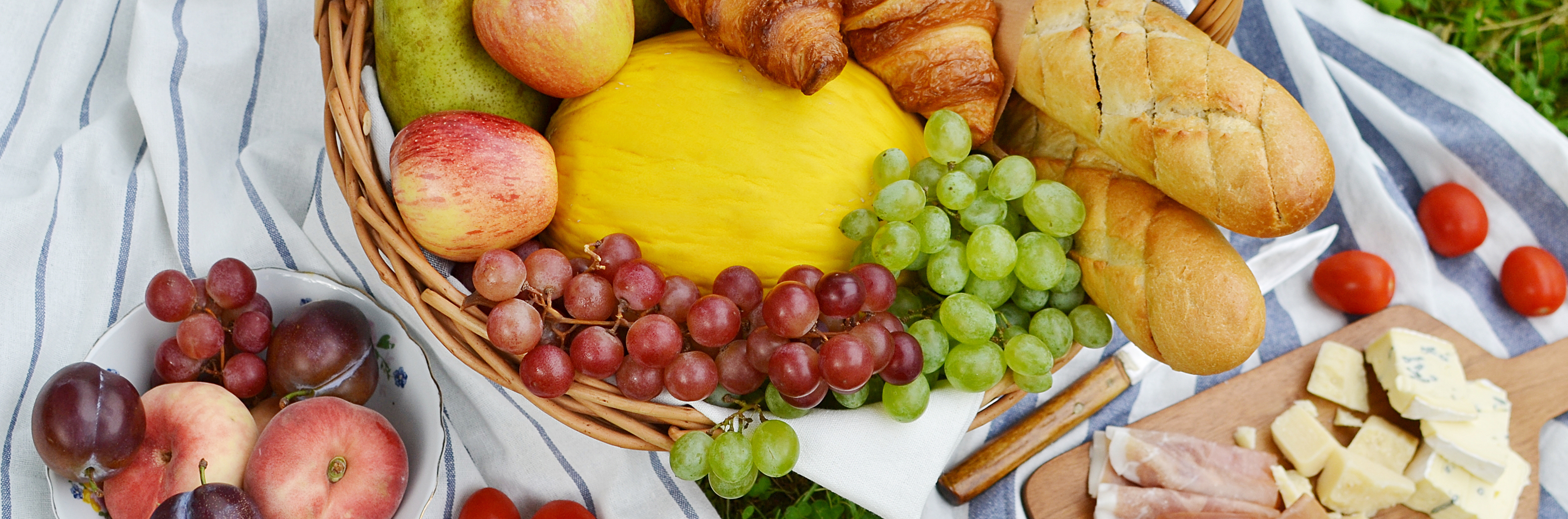 Basket of food on a picnic blanket