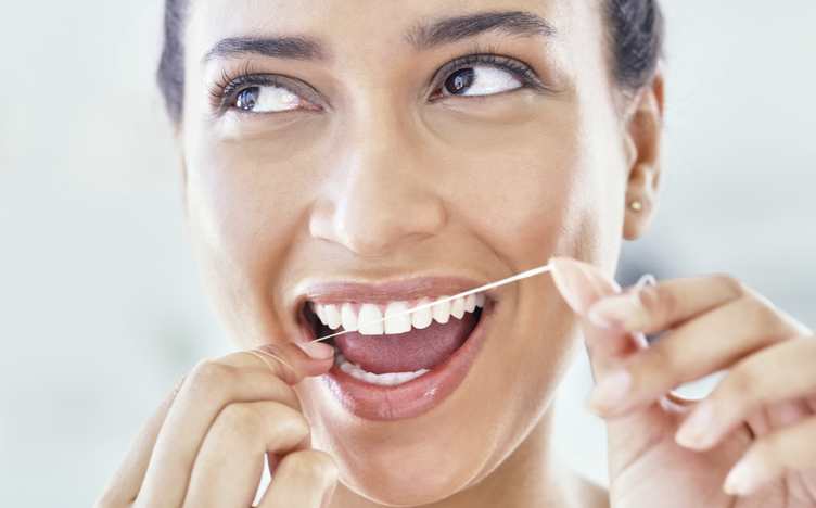 woman-flossing-752x468.png