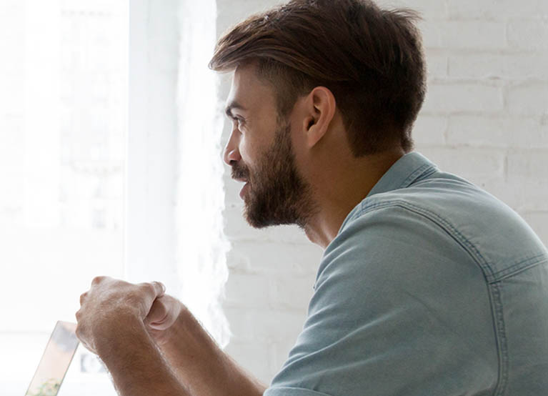 two male coworkers having a conversation mobile.jpg