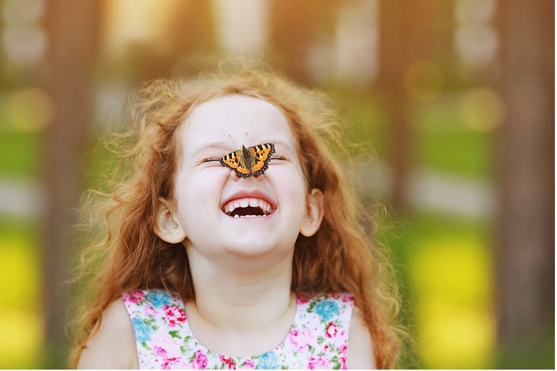 funny-laughing-curly-girl-with-a-butterfly-on-his-nose-picture-800x533jpg.jpg